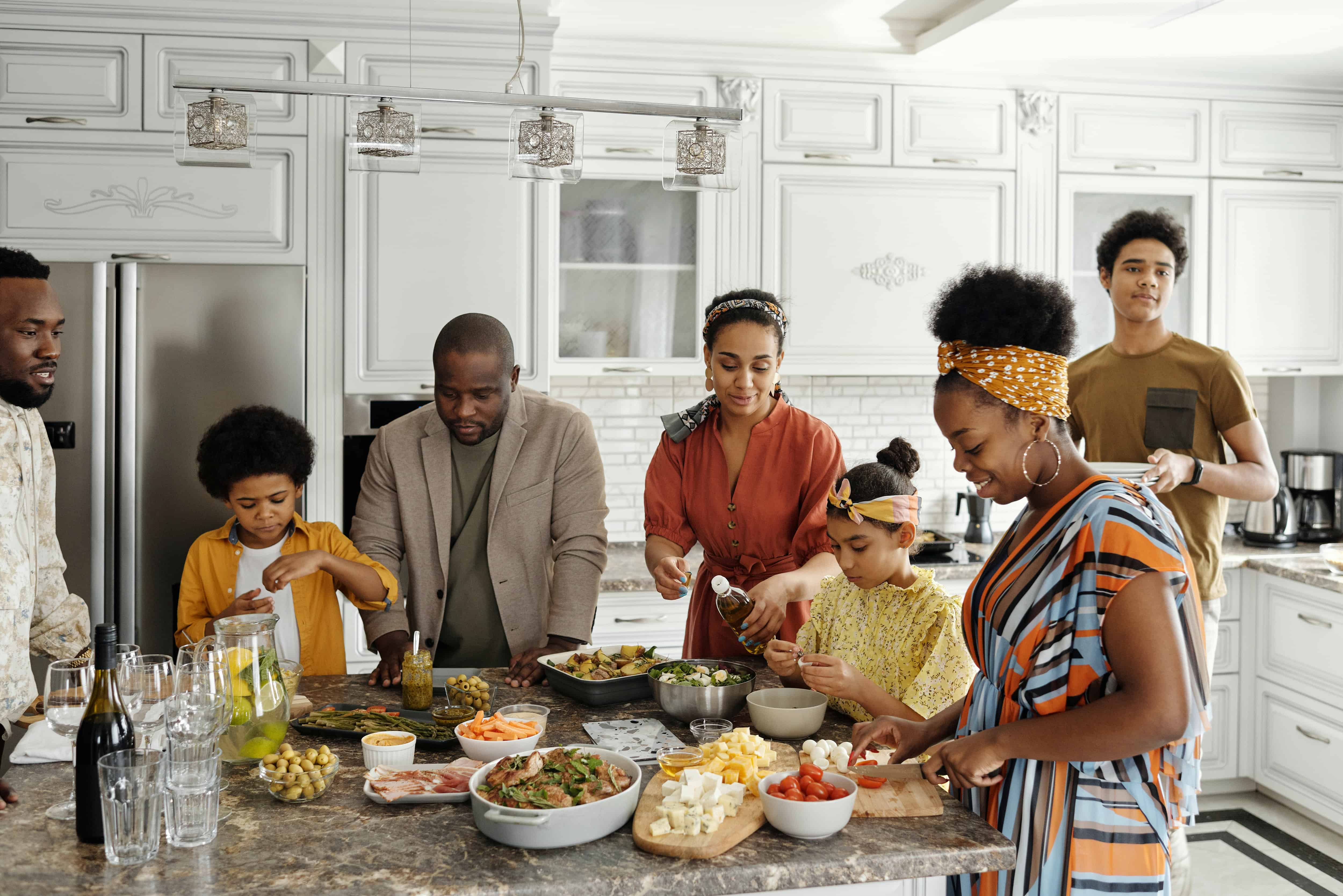 family cooking together in kitchen