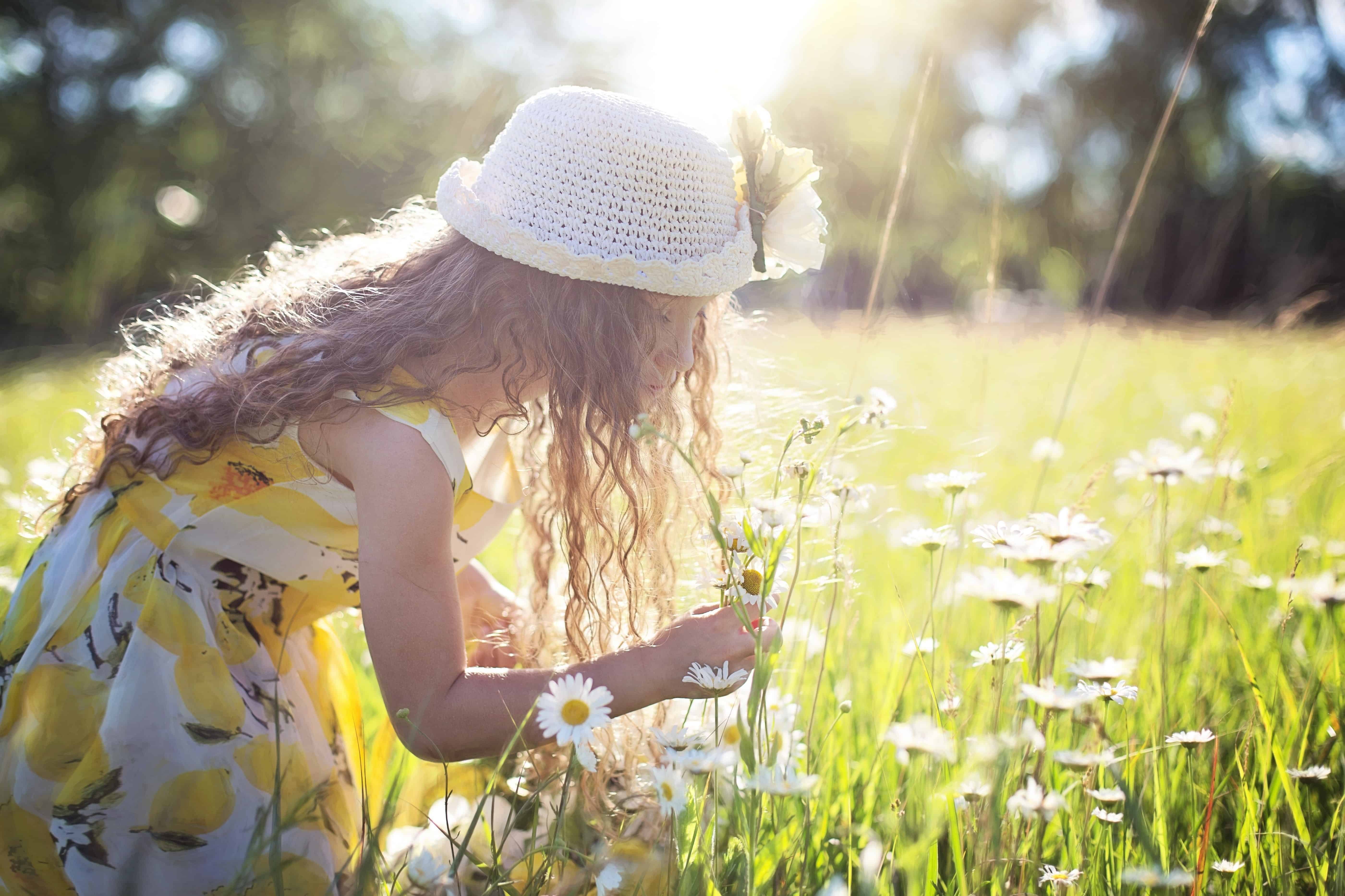 girl picking wild flowers